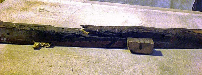 One of the charred timbers removed from the body